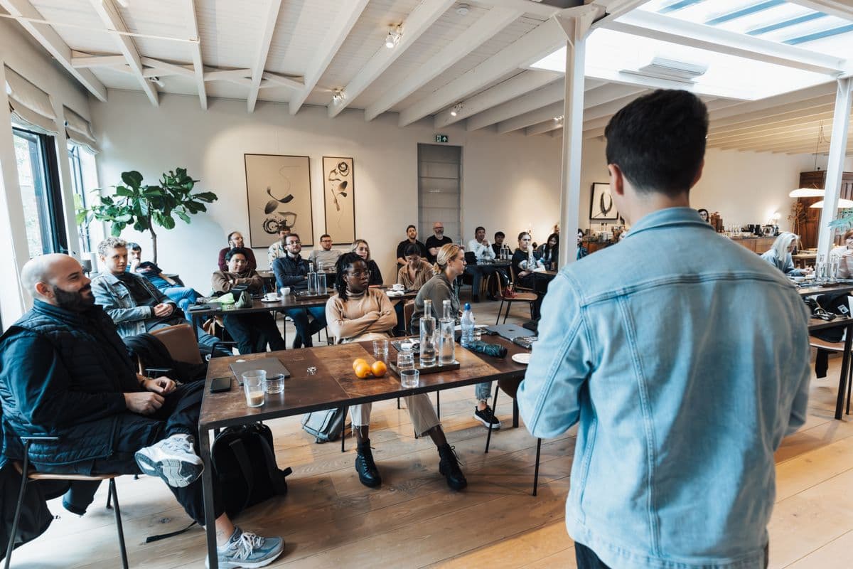 A presentation to a seated group at a business event